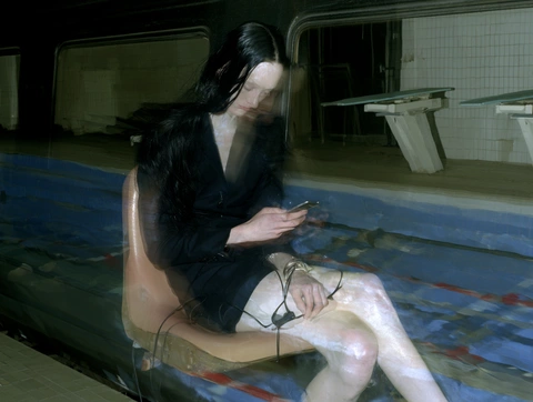 A figure at the edge of a swimming pool